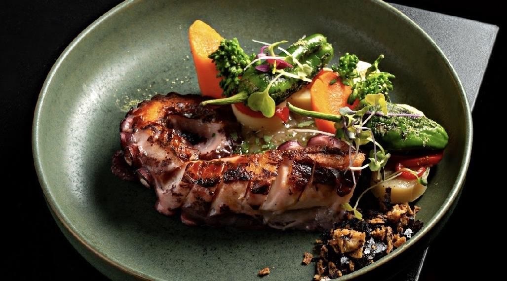 Grilled octopus with vegetables, a Vino Mío signature dish